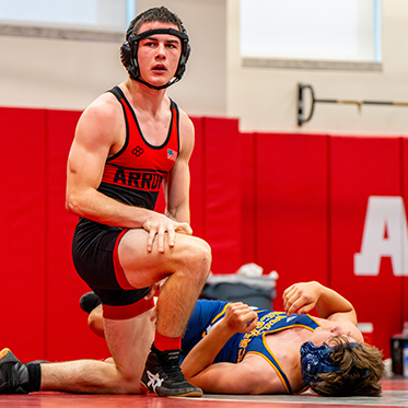 Student athletes in a wrestling match. Links to Tangible Personal Property