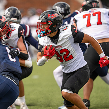 A student football game. Links to Closely Held Business Stock