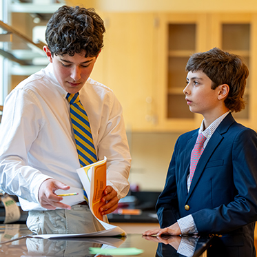 Two students working on a project. Links to Gifts of Cash, Checks, and Credit Cards